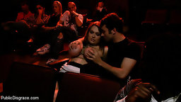 Hot girl with natural 34Fs is tied up and used as a fuck hole at a porn theater