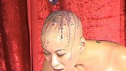 Slavegirl Kumi Monster gets hot candle wax all over her shaved head