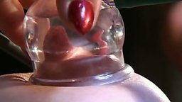 Evil bitch-Dom imprisons two captives and suctions their nipples till they swell excruciatingly. Ball gags prevent their...