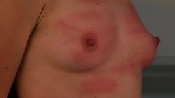 Nicole plays it classy as she gets caned across her backside