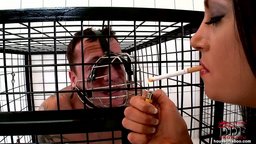 Dominatrix Emma Butt tames her pet Frank Gun in his cage!